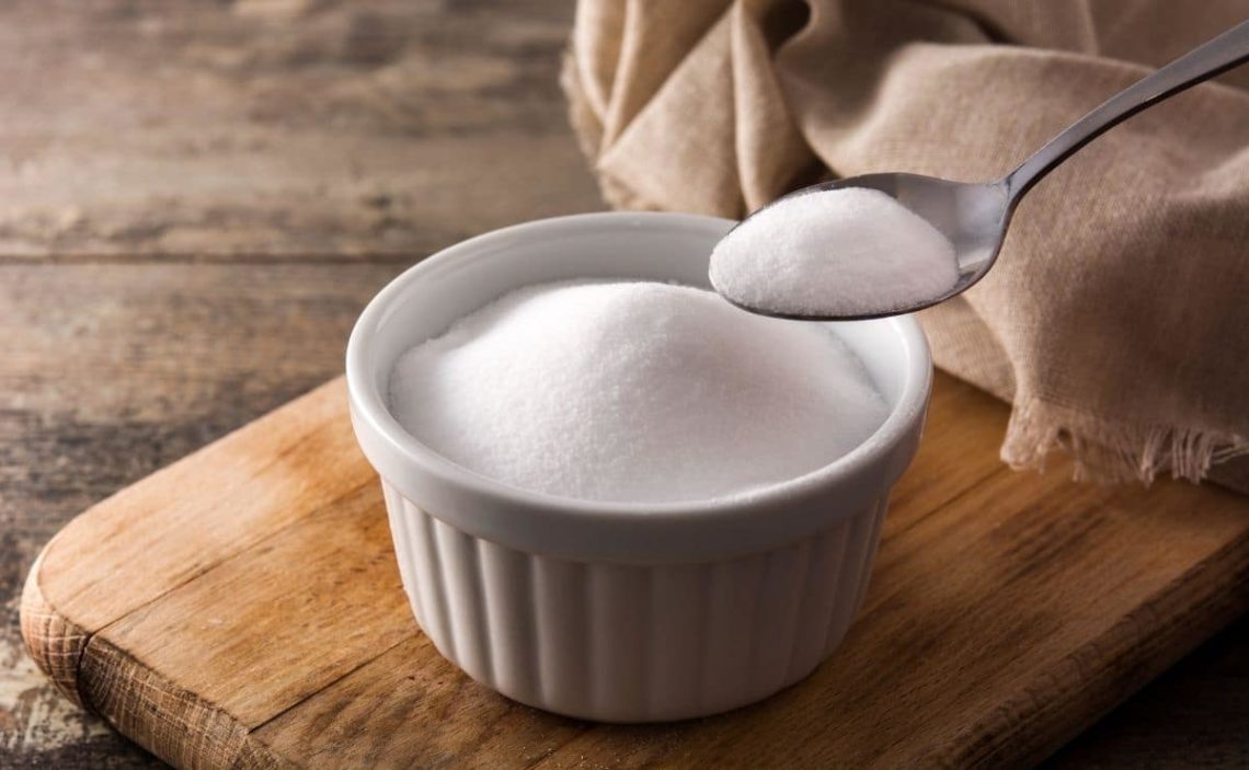 What symptoms indicate that I should stop taking bicarbonate?