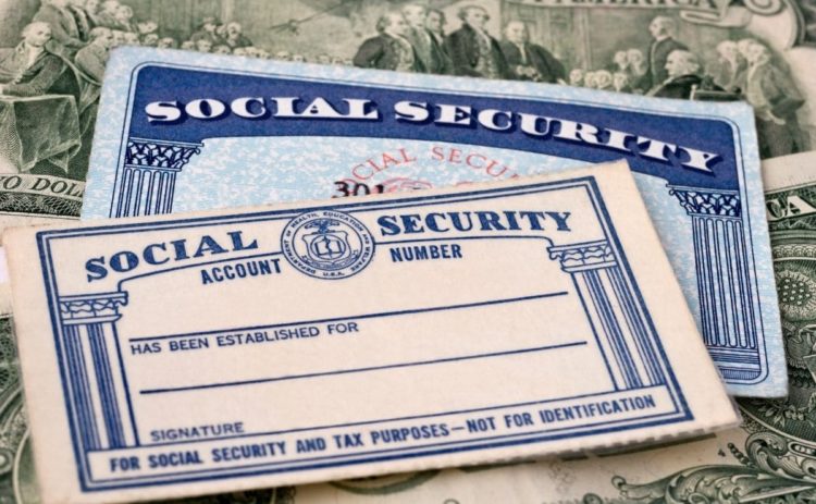 Social Security card and dollars