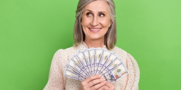 A woman is holding her retirement money