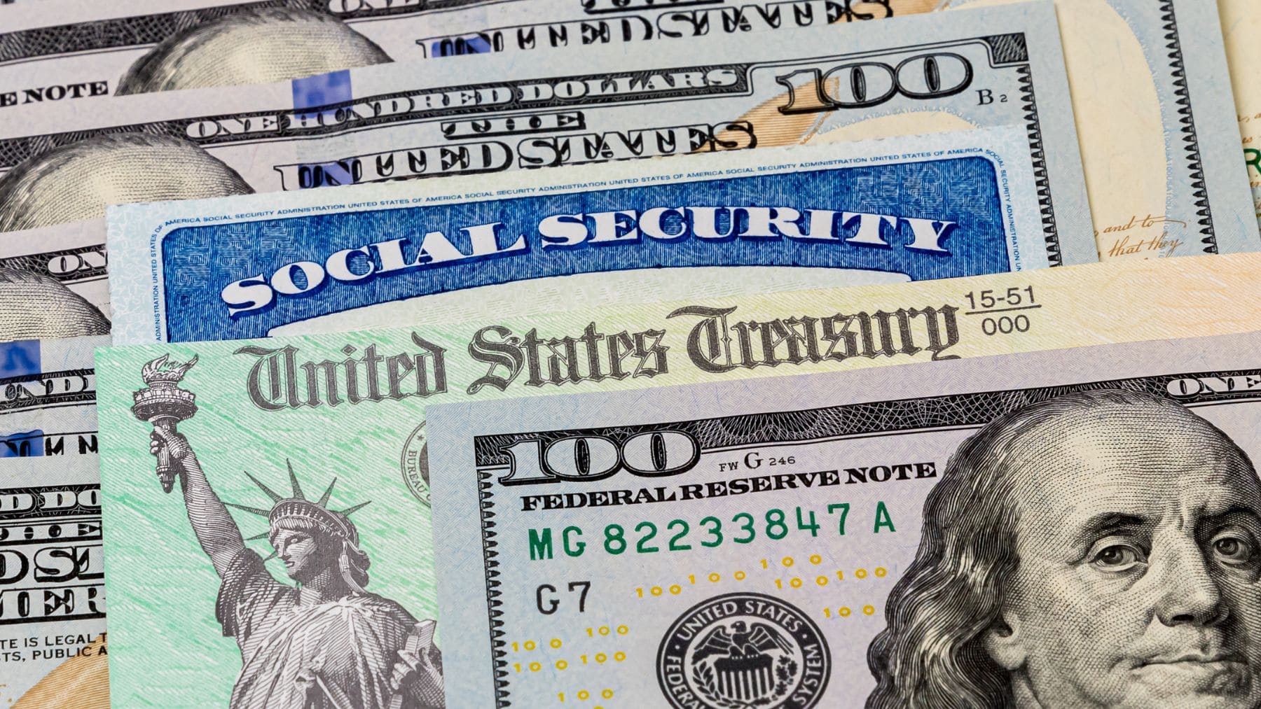 Some dollars and a Social Security card with a check