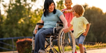 A woman with a disability and two children