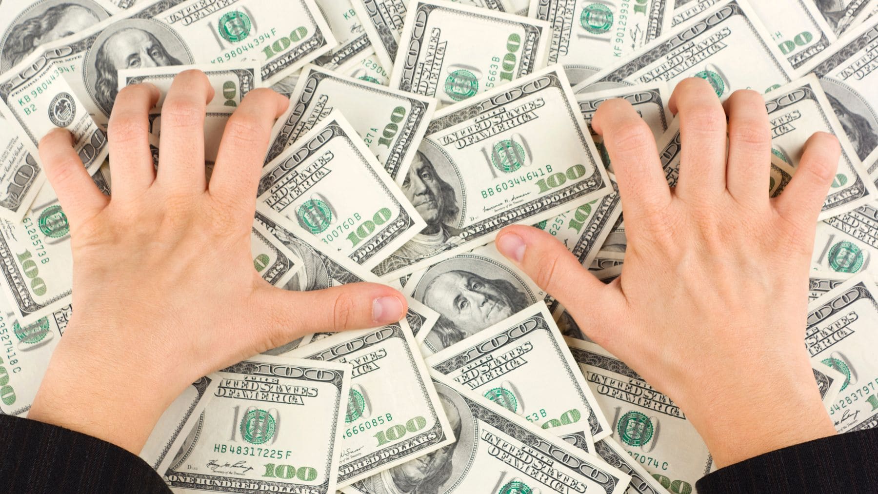 Hands grabbing some dollars from Supplemental Security Income