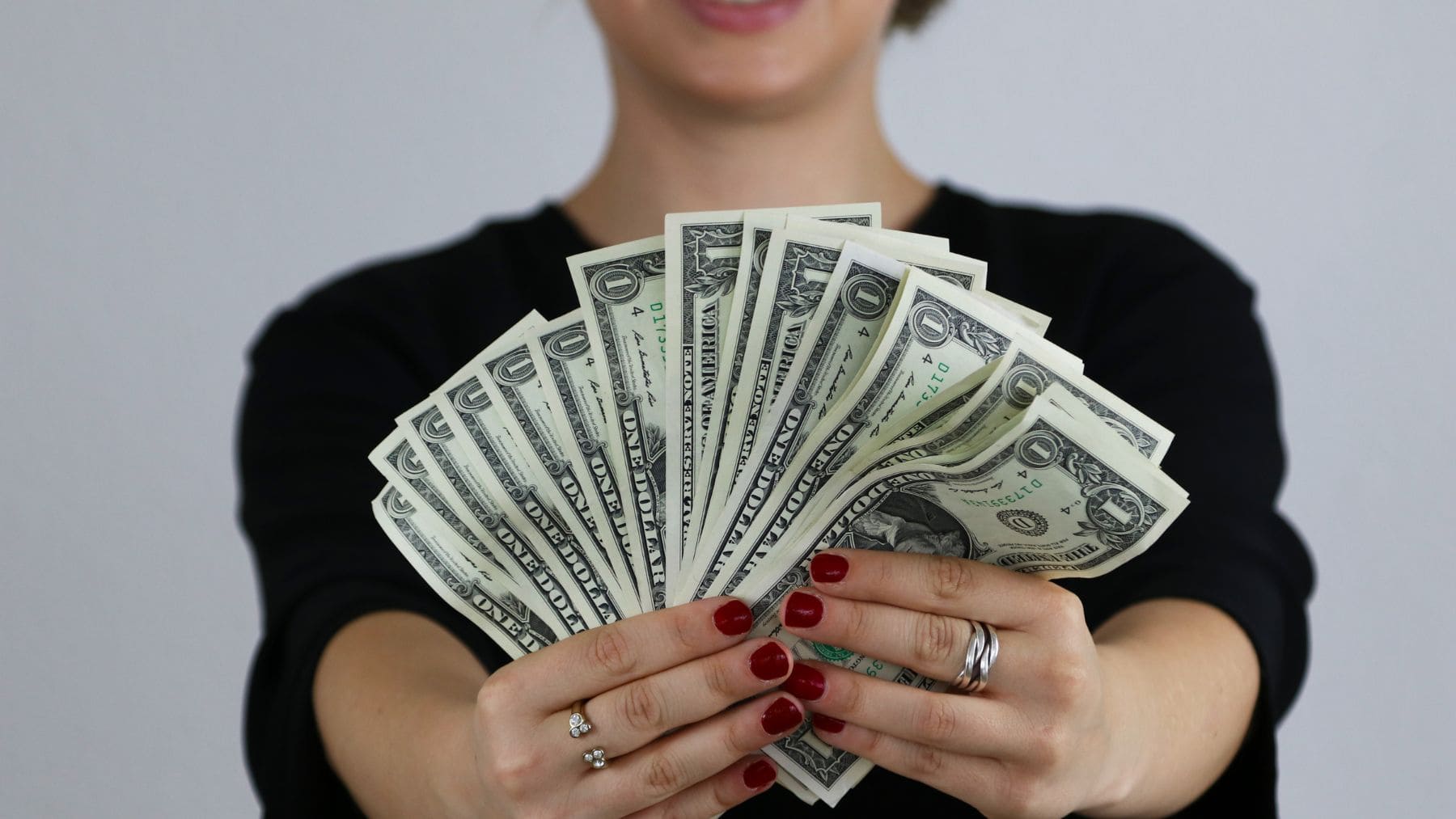 A woman holding the retirement money