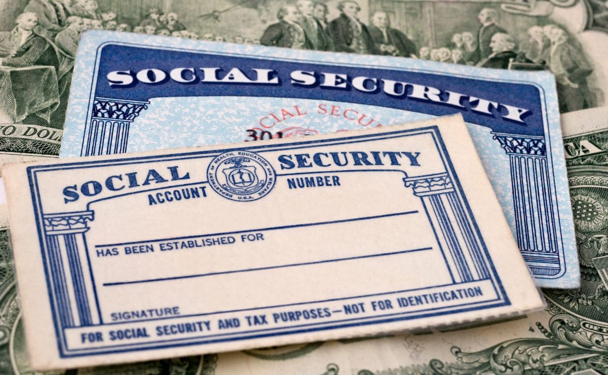 Social Security cards and dollars