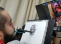 Henry Salas, el artista con discapacidad que dibuja solo con la boca